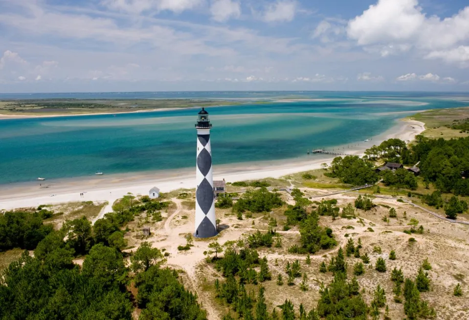 Overview shot taken of lighthouse at a beach