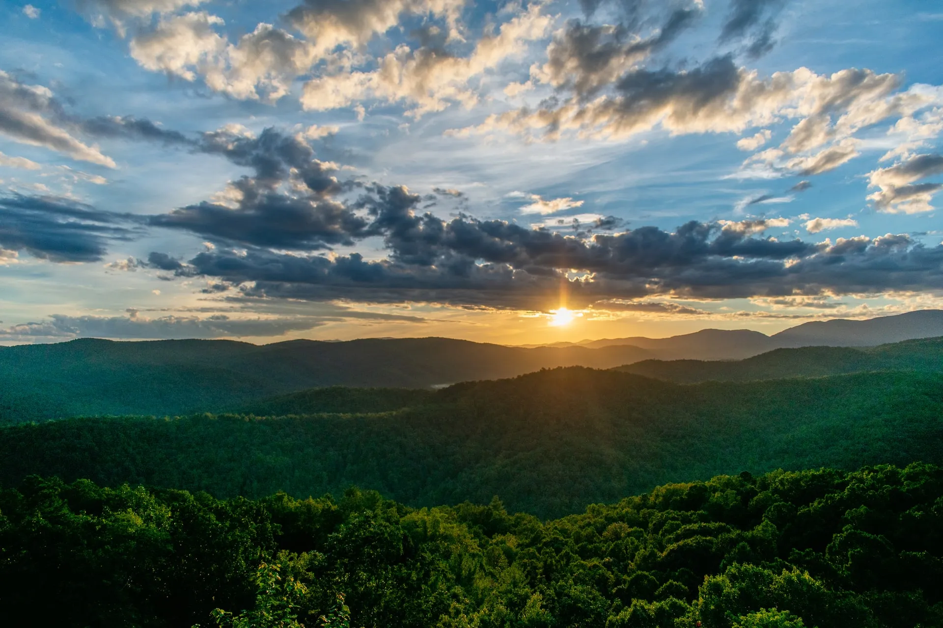 A gorgeous panoramic shot of a sunset over water