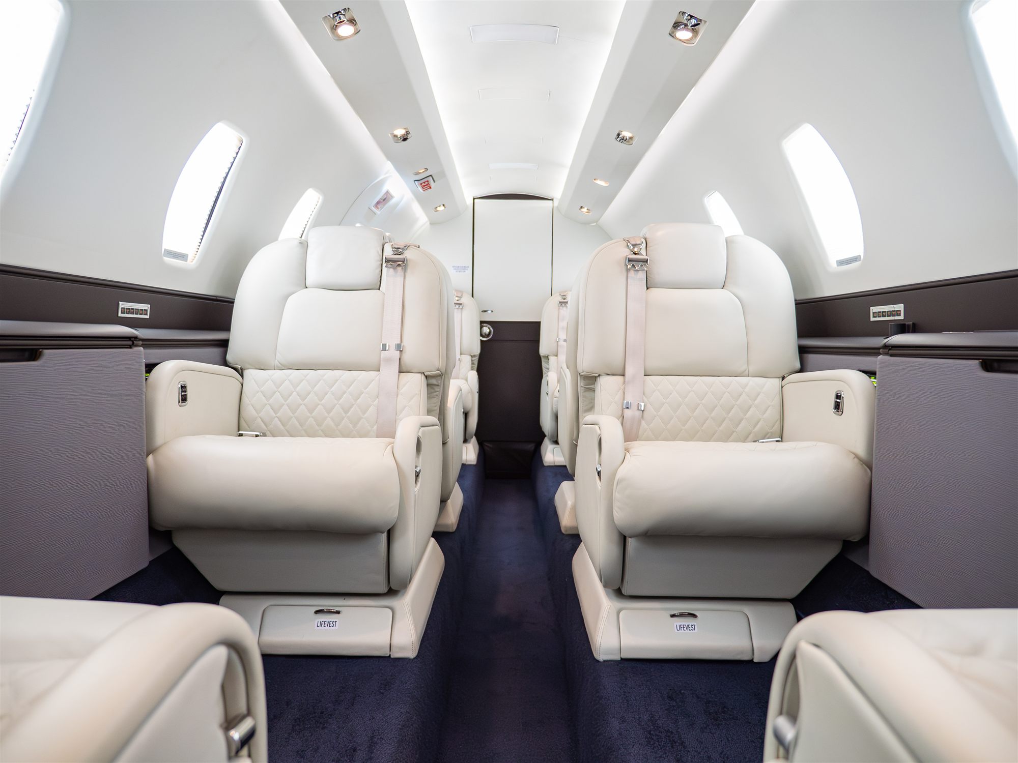 The Citation X cabin, looking aft down the aisle between facing club seats