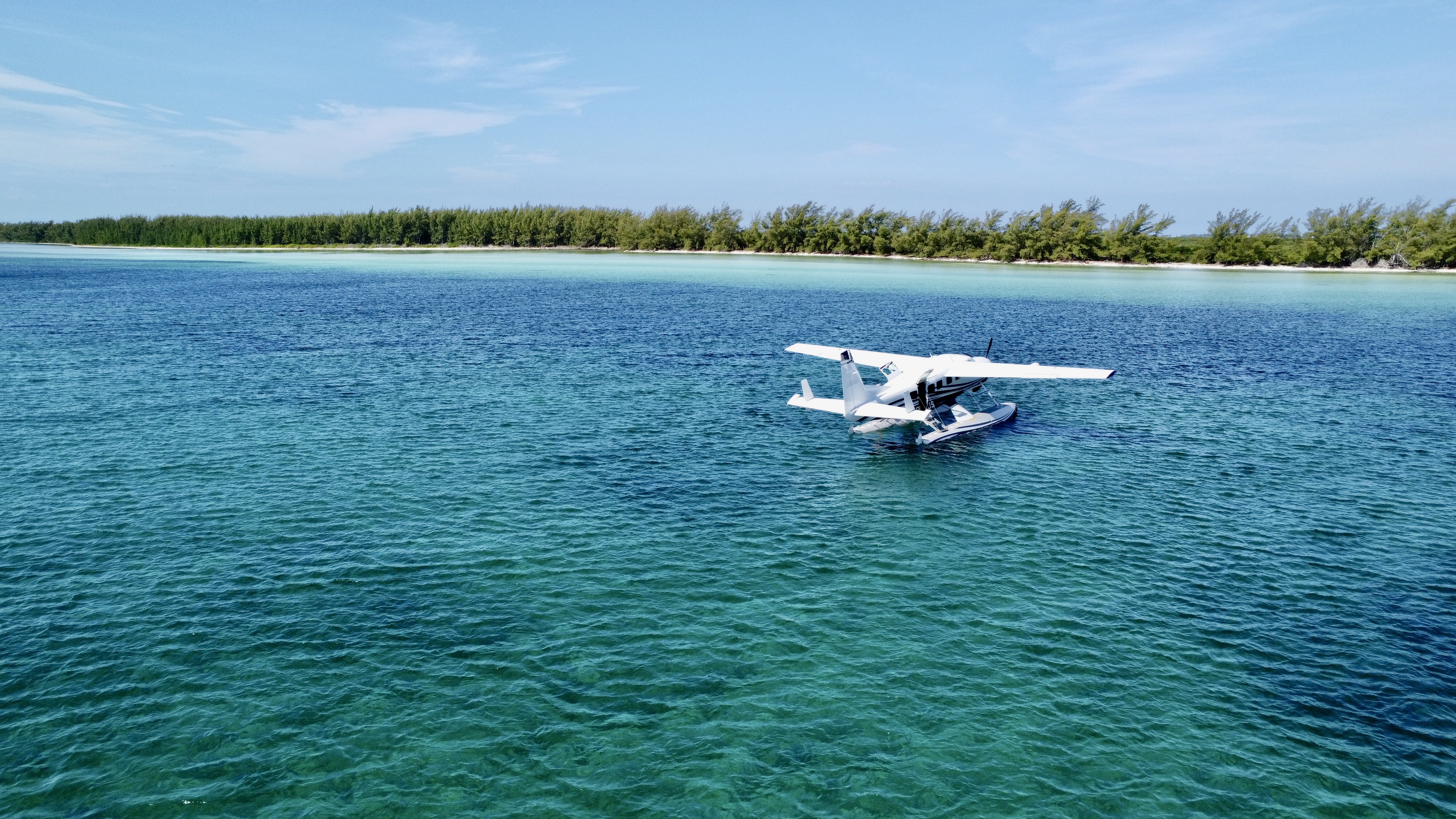 Amphibious Caravan seaplane in flight over the islands